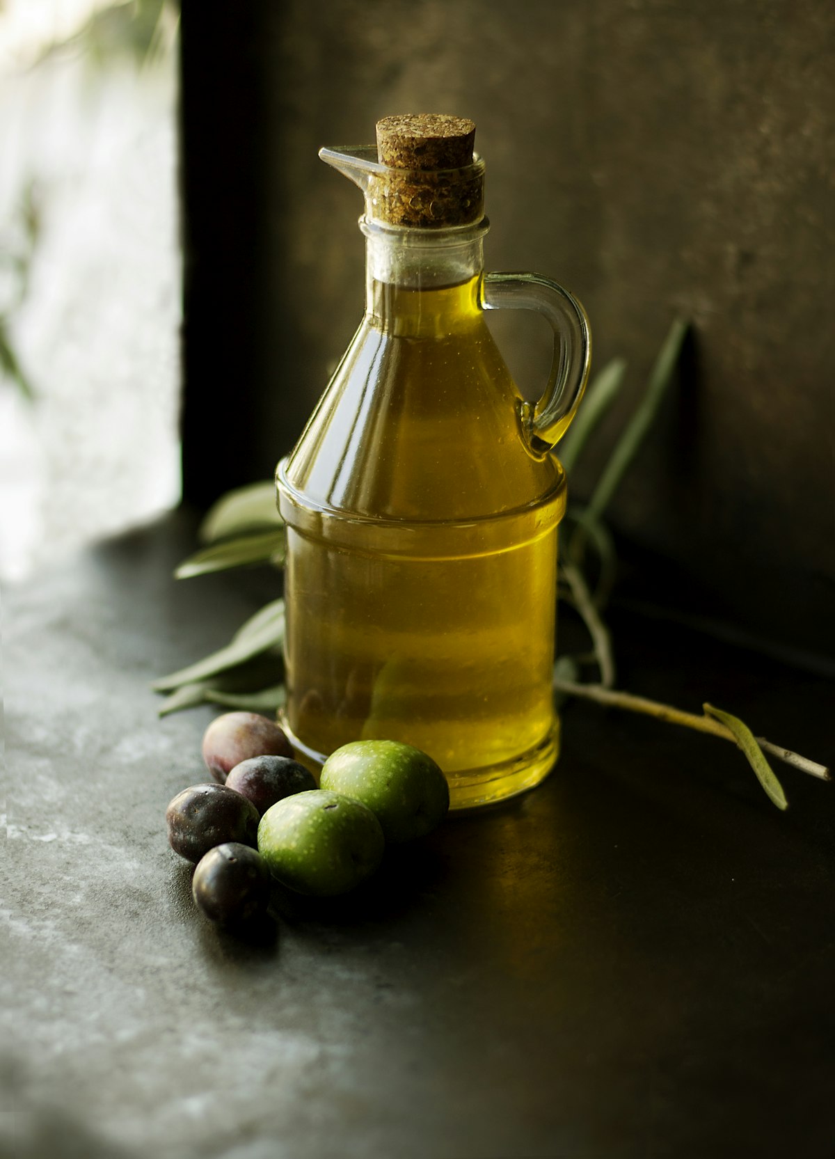 Dark glass bottle of extra virgin olive oil