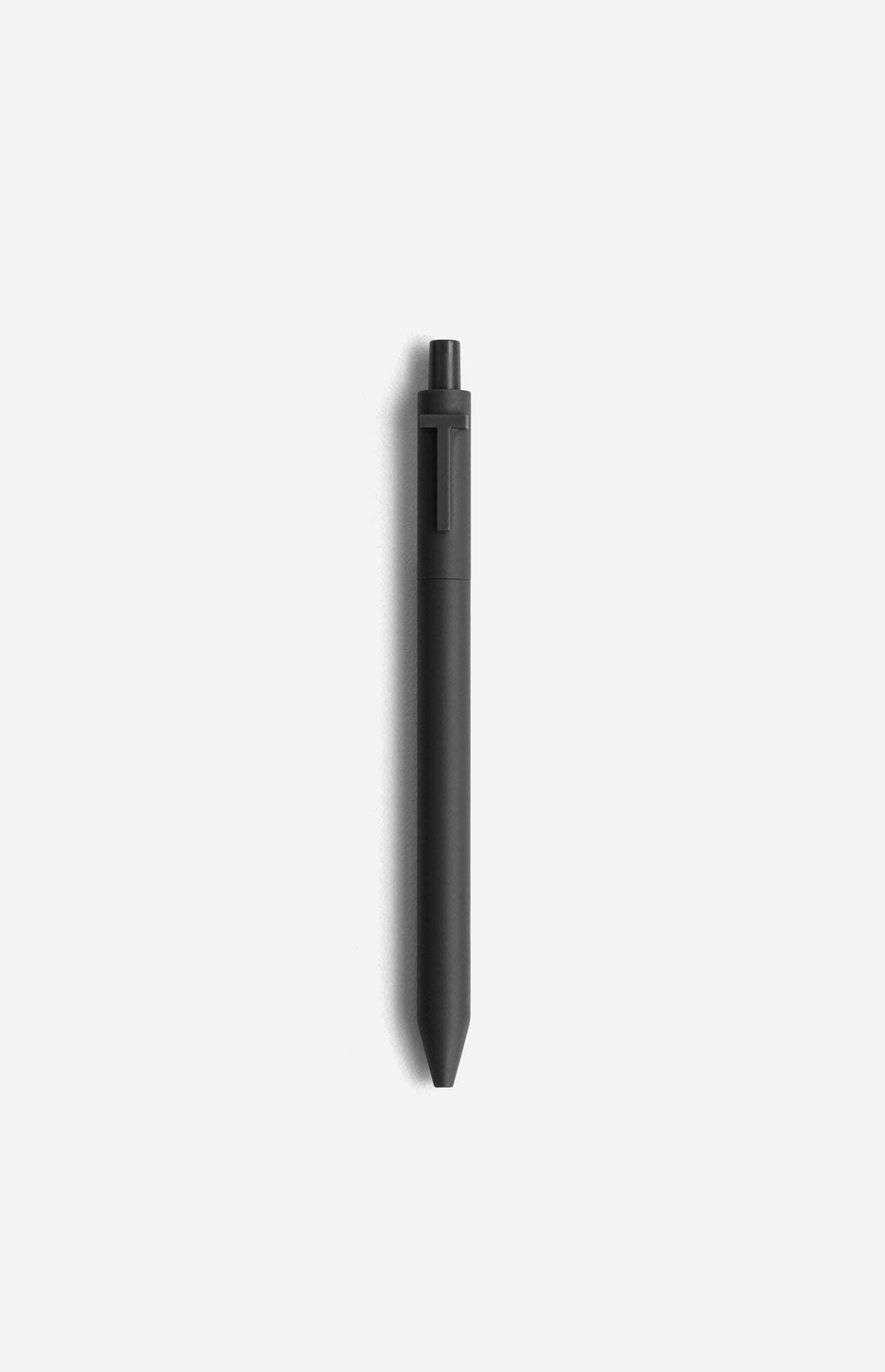 Classic fountain pen resting on handwritten parchment